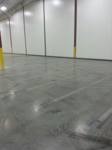 Concrete floor etched with a shotblaster prior to painting